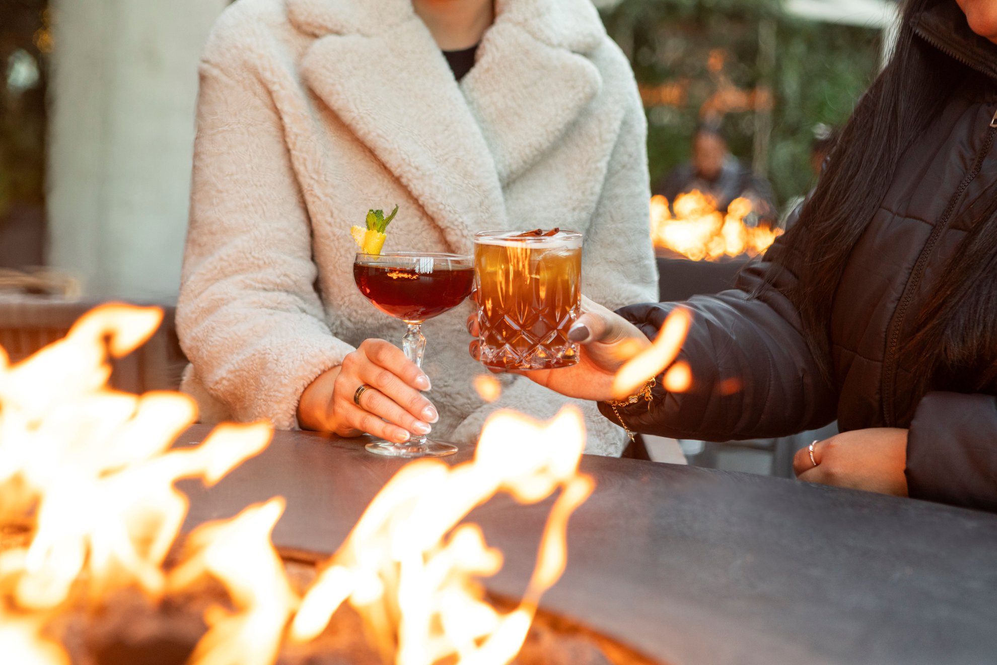Enjoy fora chicago signature cocktail drinks and the warmth of sitting next to firepit