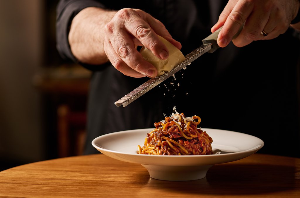 Chef Marcello Florio garnishing handmade chittara spaghetti